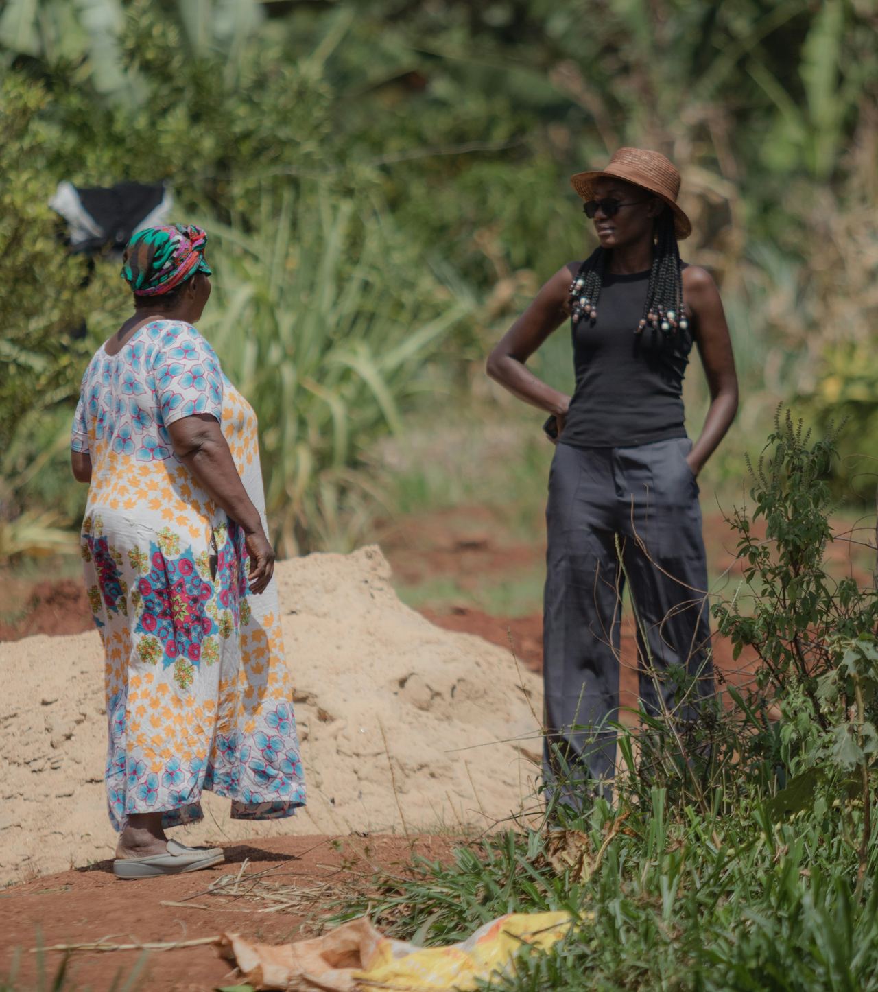 Two women farmers standing together in a field
