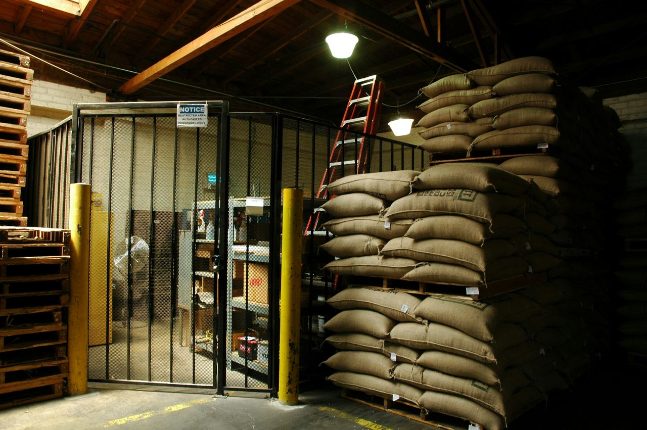 Sacks of produce stacked in a store