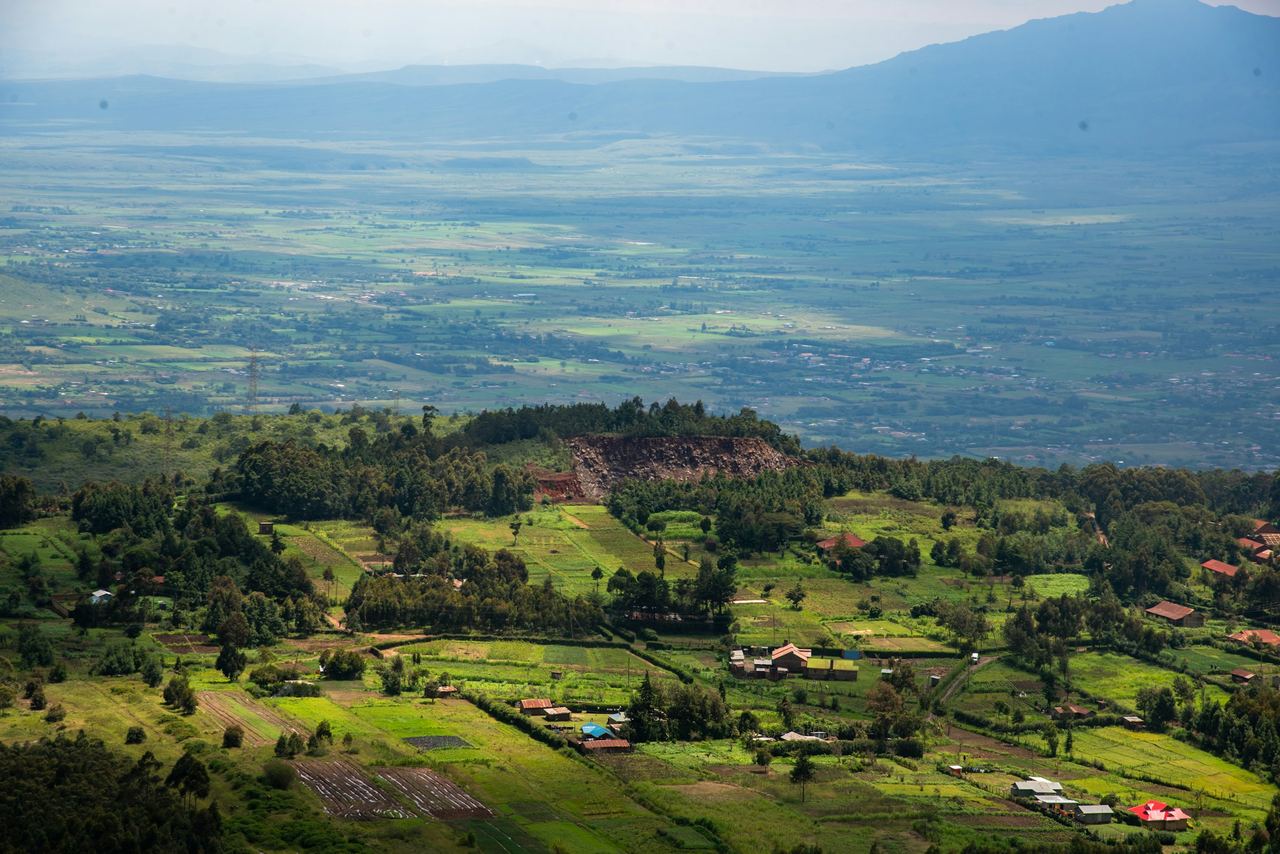 Farmland and green hills stretching across a valley in Kenya